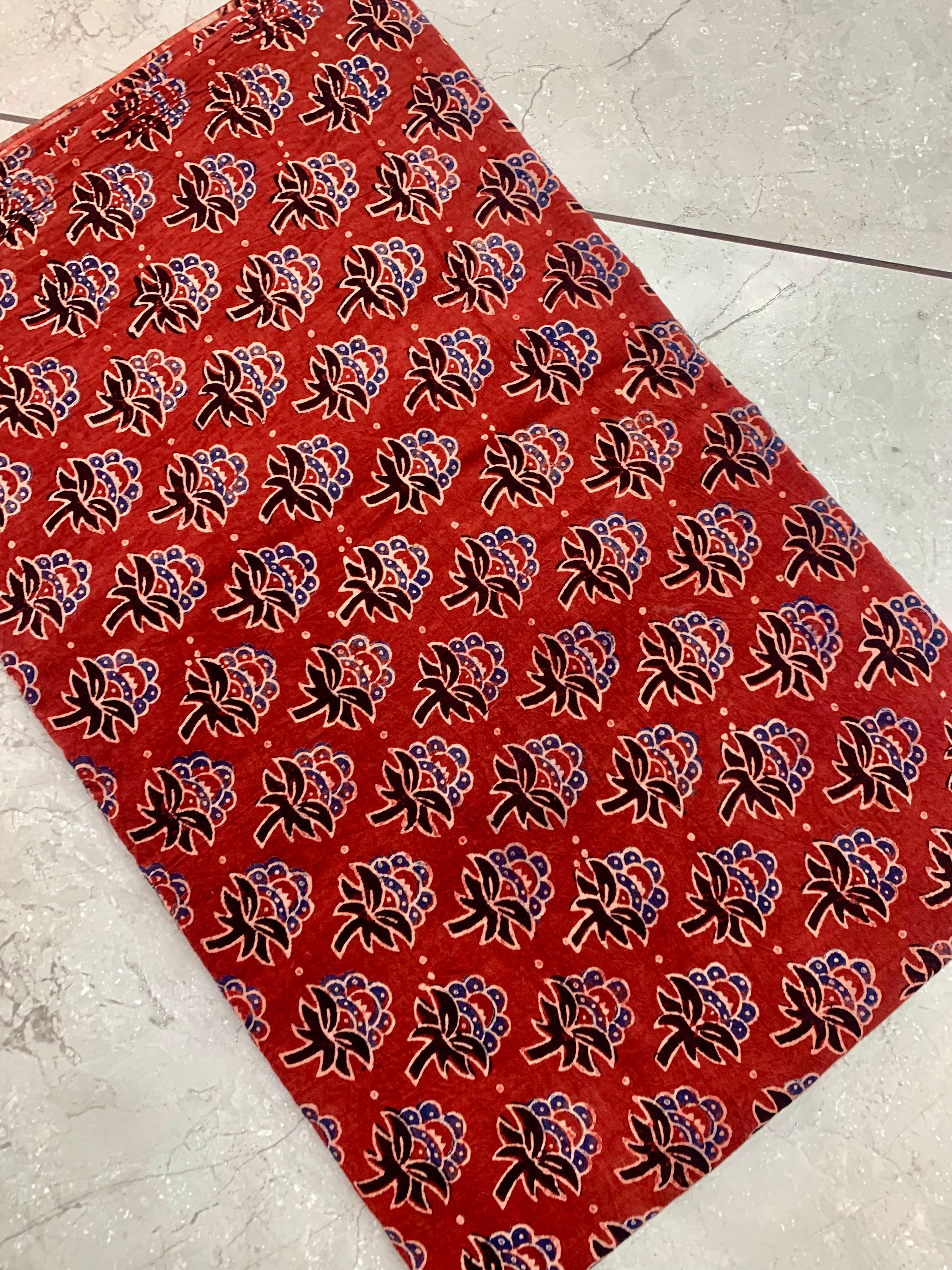 Maroon butti Ajrakh handblock printed pure cotton wholesale fabric with intricate motifs by Fabtexs.